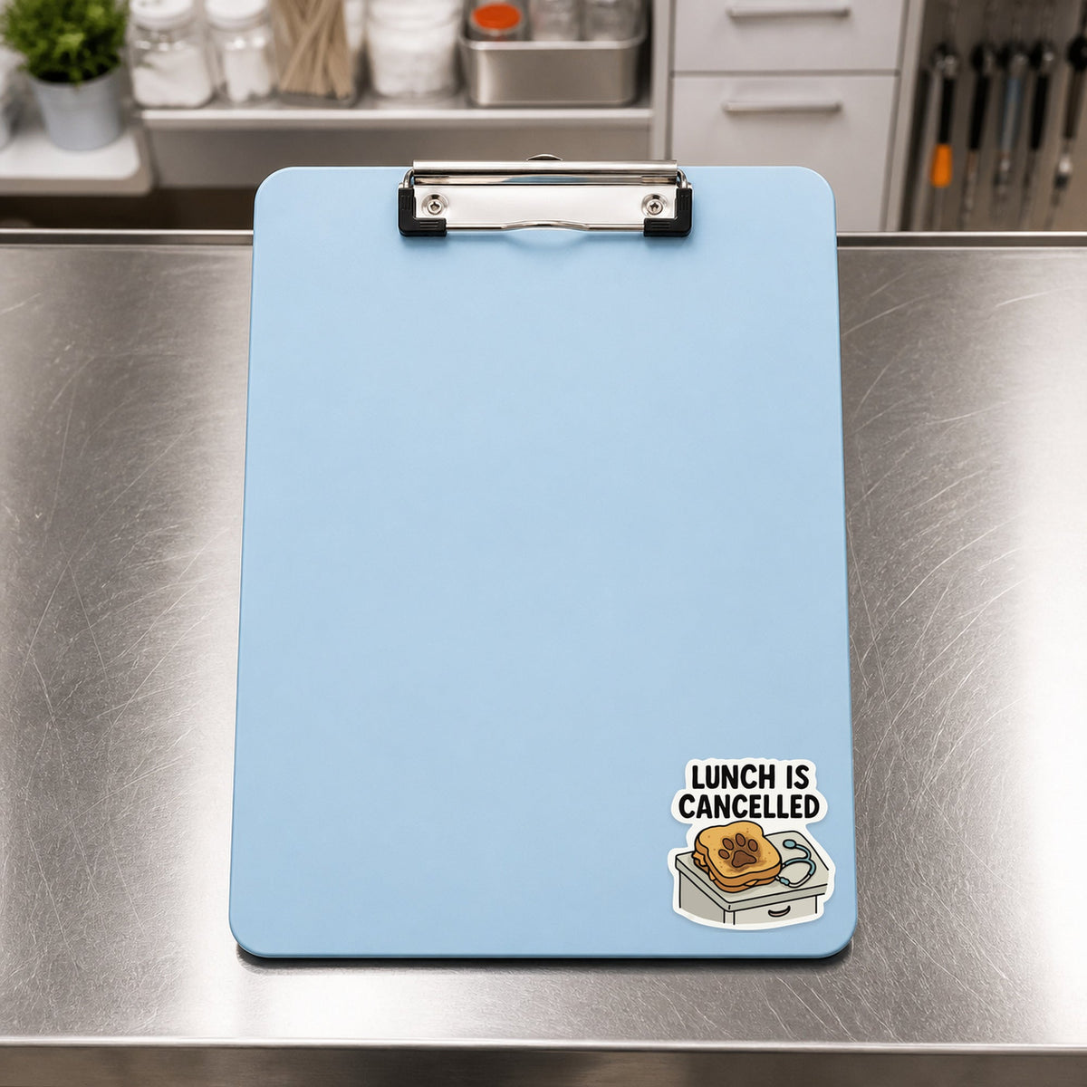 Lunch Is Cancelled – Funny Veterinary Sticker shown on a blue treatment clipboard