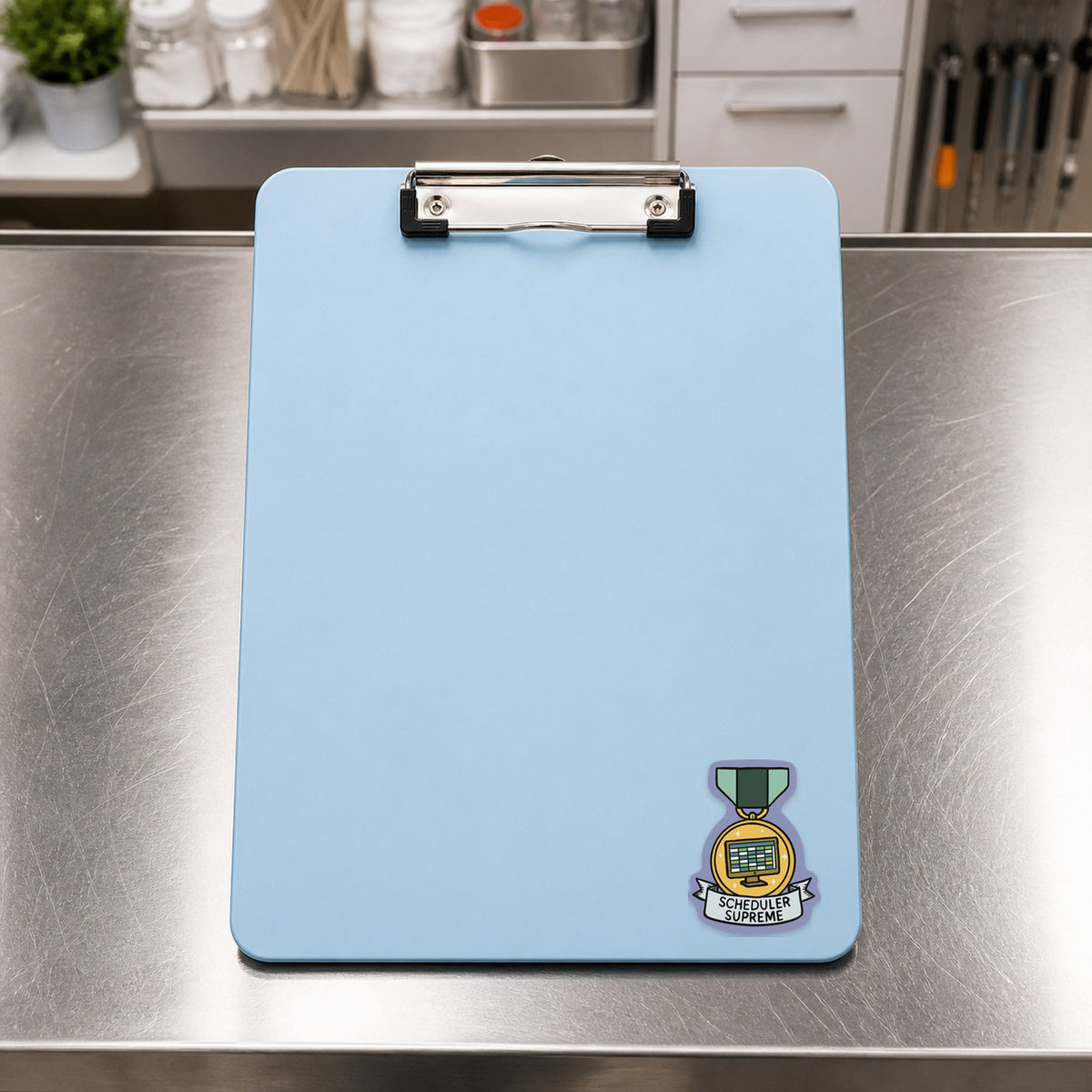 Scheduler Supreme – Funny Veterinary Award Sticker shown on a blue treatment clipboard