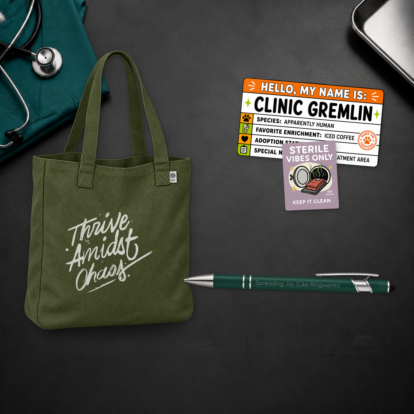Thrive Amidst Chaos deluxe veterinary shift bundle with an olive tote, card, notepad, pens, and stickers, shown in a close material-detail scene for veterinary professionals