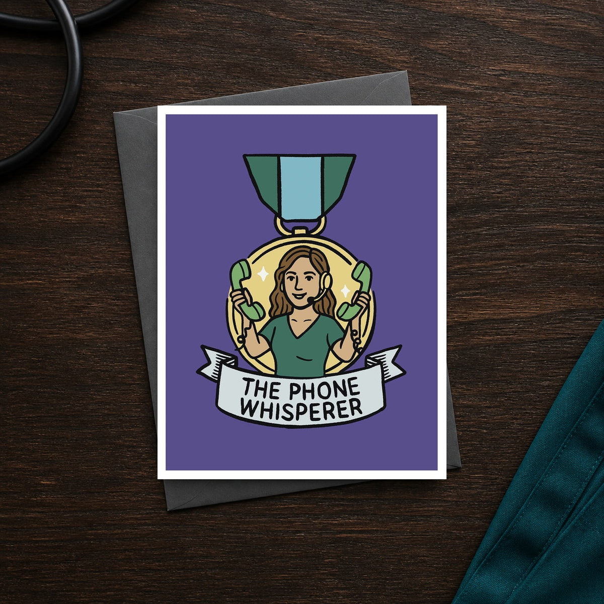 The Phone Whisperer A2 veterinary recognition notecard front on a dark clinic desk
