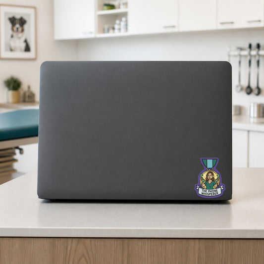 The Phone Whisperer – Award Medal Sticker shown on a veterinary clinic laptop