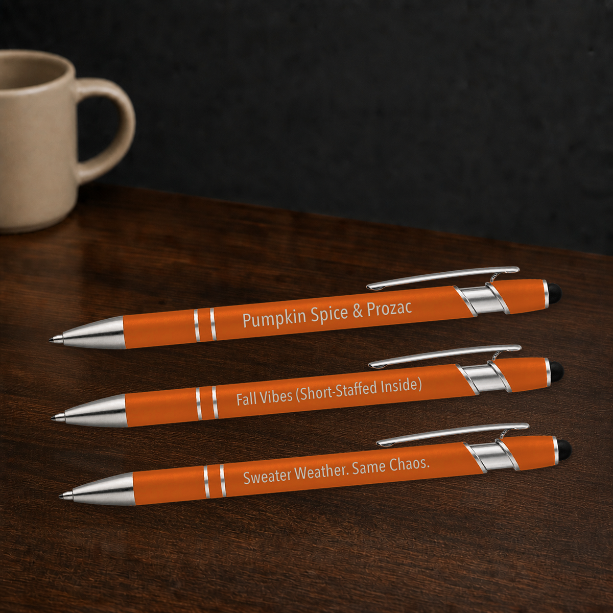 Fall Pen 3-Pack orange veterinary gel pens engraving detail beside a coffee mug