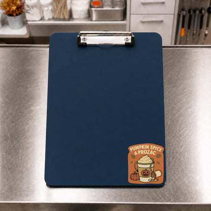 Pumpkin Spice and Prozac fall veterinary sticker on a navy clinic clipboard