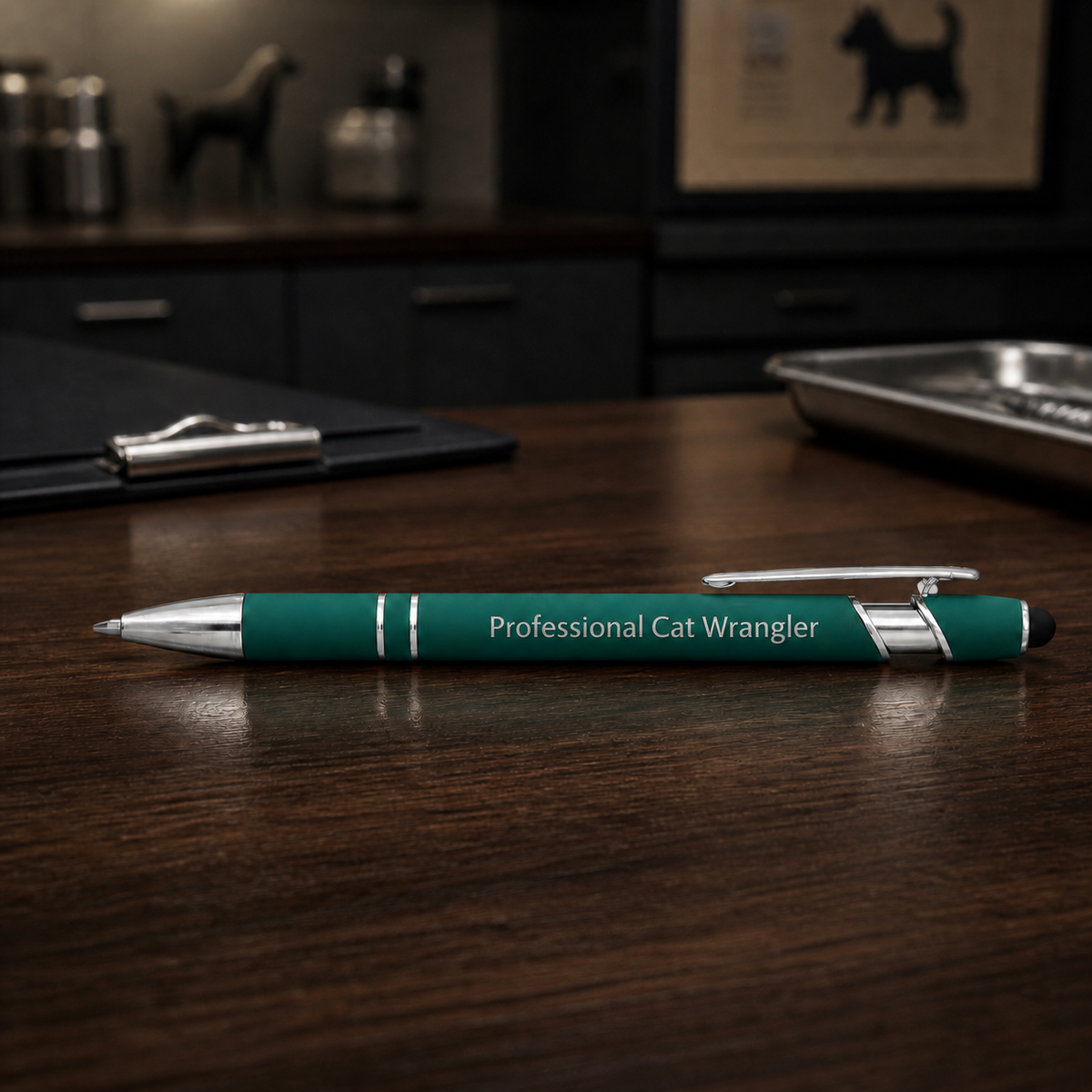 Dark green Professional Cat Wrangler laser-engraved veterinary pen on a dark clinic desk