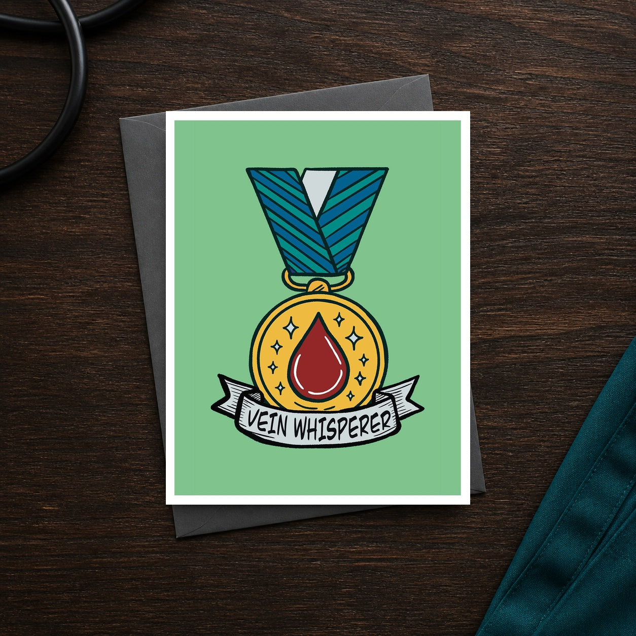 Vein Whisperer A2 veterinary recognition notecard front on a dark clinic desk