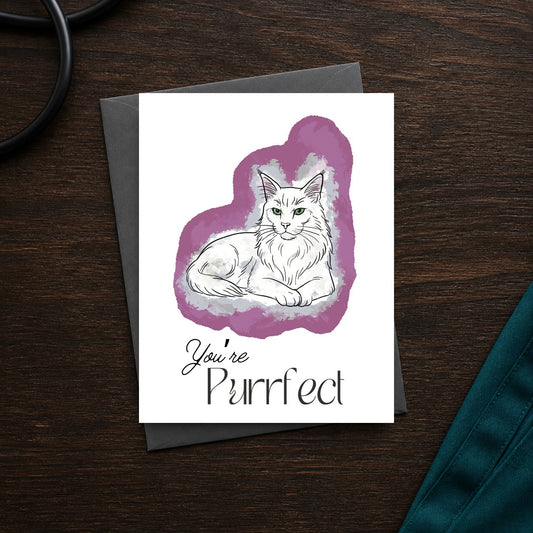 You're Purrfect A2 veterinary notecard front on a dark clinic desk